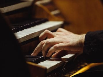 close up of organist hands
